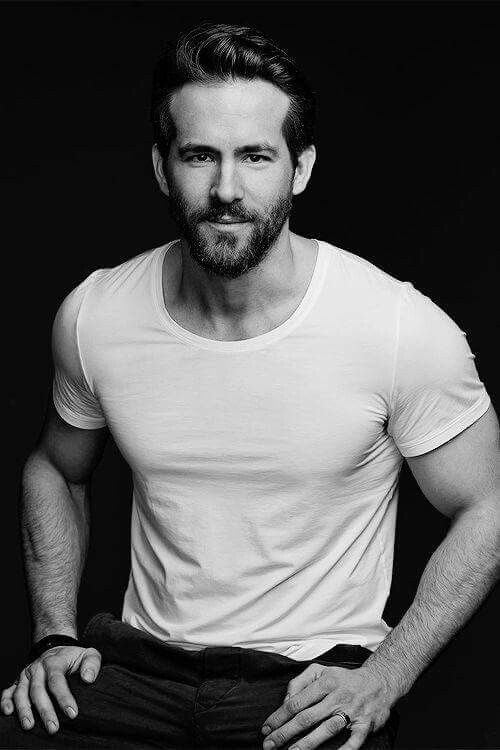black and white picture with Ryan Reynolds sitting down